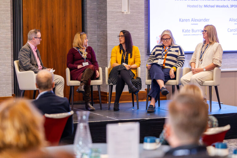 One man and four women on a panel discussion at a Durham networking event
