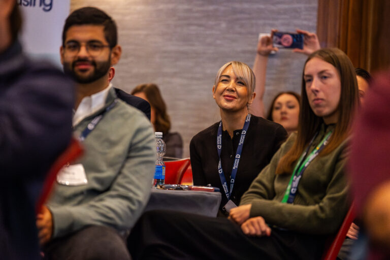 A group of men and women attending a networking event in Durham