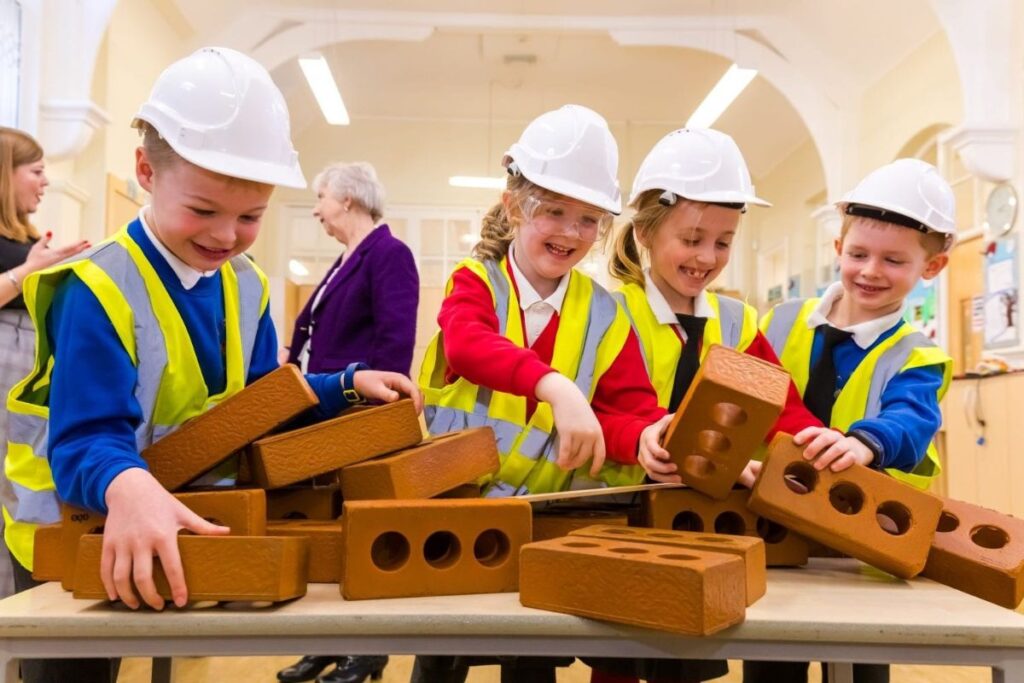 Primary school pupils playing with foam bricks as part of a STEM workshop